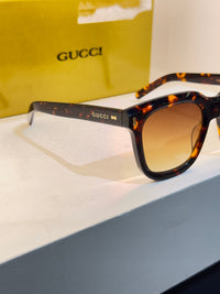 Gucci carrée au motif écaille brun et ambré, avec verres jaune-orangé — photo réelle 3 de la paire chez NVL